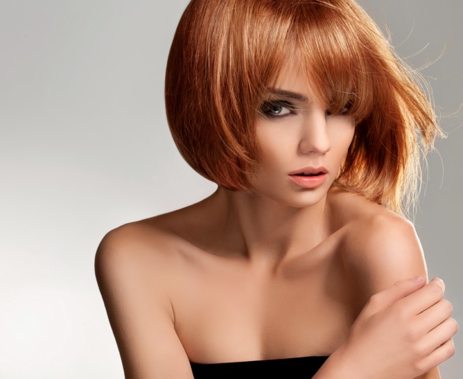 Red hair. Beautiful Woman with Short Hair. High quality image.